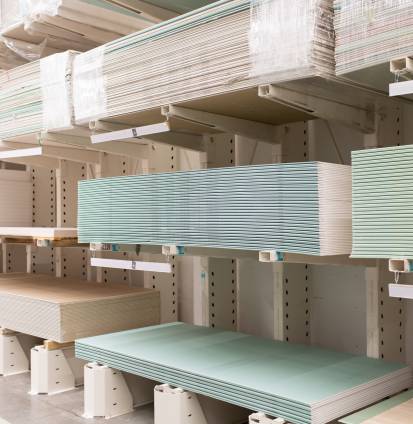 Pallet with Drywall sheets plasterboard in the building warehouse store